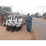 the parish catechist on the procession.JPG